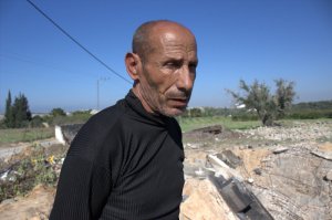 Mahmoud Ahmed Abu Sitta at the wreckage of his house in Jahar al-Deek, Gaza (photo by Patrick Keddie)