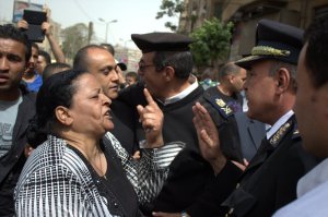 Demonstrators remonstrate with the police over the previous night's attacks (photo by Patrick Keddie)