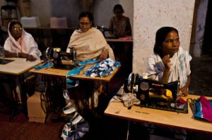 With the help of Indian NGO Sulabh, widows work on textiles that will later be sold on local markets. The women are also being trained by Kopal, a New York-based fashion designer (photo by David Shaw)